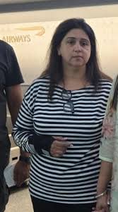 Monika Kapoor escorted by CBI officers after extradition from US 